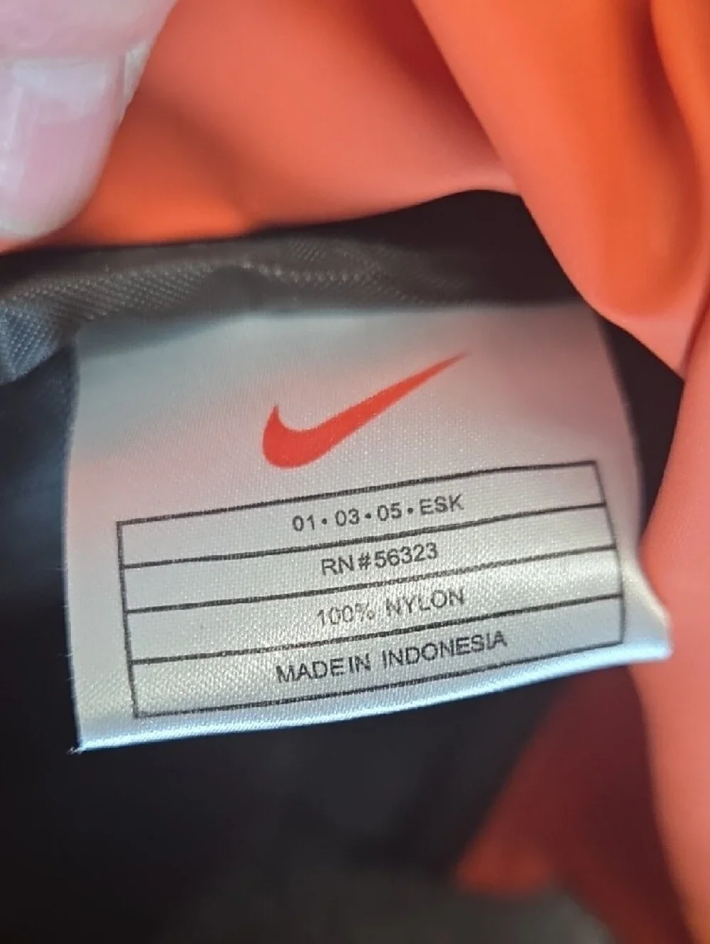 Nike Men’s Orange Duffel Bag with White Swoosh and Black Accents